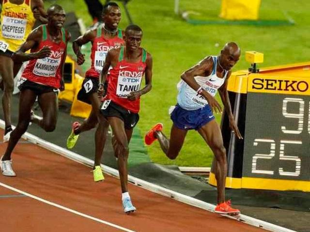 Tough guy - Mo Farah is tripped but keeps going on his way to gold
